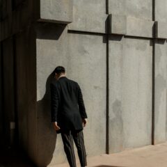 ref https://unsplash.com/photos/man-in-black-suit-banging-his-head-on-wall-Pd-bOA-MZQs